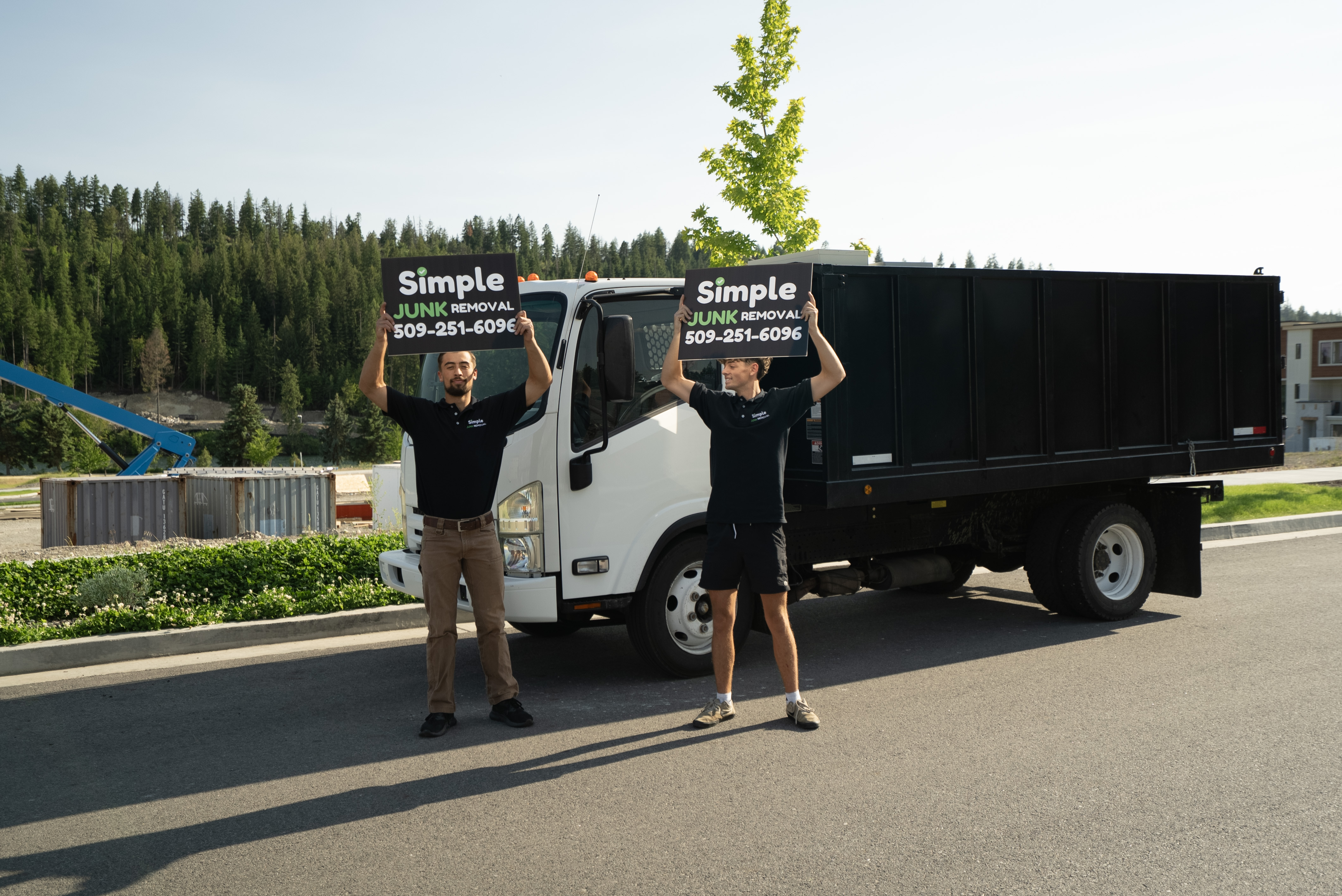 Frank and Romen with the Simple Junk Removal truck in Coeur d'Alene